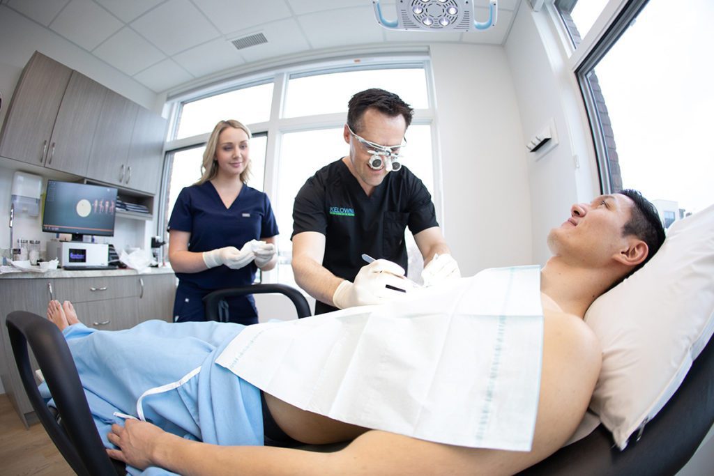 Dr Ben Wiese from Kelowna Skin Cancer Clinic examining a patient for Merkel Cell Carcinoma.